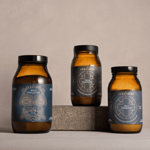 Three amber glass jars with black lids on a neutral background. Wild Collagen, True Creatine and True Hydrate