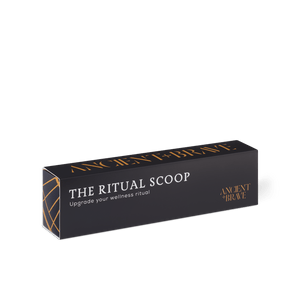 A black rectangular box labeled Ritual Scoop by Ancient + Brave, featuring gold and white text like “Upgrade your wellness ritual,” showcases a golden scoop—an ideal wellness gift—set against a light background.