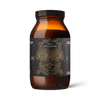 A 200g brown glass jar of Ancient + Brave True Collagen features a gold geometric face on a black label and contains hydrolyzed bovine collagen supplement powder to support joint health and skin elasticity.