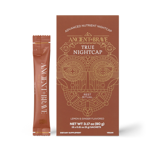 A box and sachet of Ancient + Brave True Nightcap Sachets, a lemon and ginger flavored supplement. The geometric gold design highlights this nutrient nightcap for restful rituals.