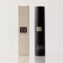 Black KOOK solar moisturizer bottle and beige box on a white background