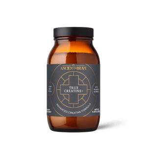 Amber supplement bottle labeled 'True Creatine+' by Ancient & Brave on a green background