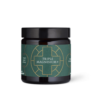 Jar of Triple Magnesium+ supplement with green label and black lid on a transparent background