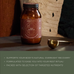 A jar labeled Ancient + Brave True Nightcap rests on a dark surface beside a gold measuring spoon; a green banner below highlights its Rest Ritual benefits, overnight recovery support, and targeted nutrients.