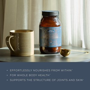 A jar of Ancient + Brave Wild Collagen sits on a round table beside a ceramic mug and gold spoon, with text below highlighting its whole-body, joint, and skin benefits as sunlight softly illuminates the scene.
