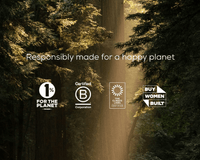 Sunlight streams through tall forest trees with eco-certification logos and the text, Responsibly made for a happy planet. Logos include 1% for the Planet, B Corporation, Climate Label Certified, and Buy Women Built.