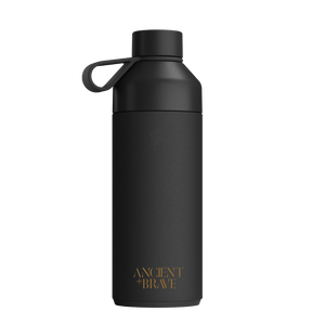 The Ancient + Brave x Ocean Bottle 750ml from Ancient + Brave US is a matte black limited edition bottle with a looped lid and gold “ANCIENT + BRAVE” text near the bottom, shown against a white background.