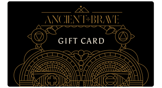 The Ancient + Brave Gift Card features black with gold geometric and ornamental designs, ANCIENT + BRAVE at the top, and GIFT CARD centered in white—a stylish wellness gift from Ancient + Brave that inspires wellbeing from within.