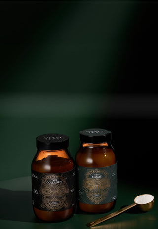 Two brown bottles with labels on a dark green background