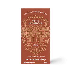 A rust-colored, rectangular box labeled Ancient + Brave True Nightcap displays gold geometric designs. This vegan Lemon & Ginger Flavored dietary supplement (6.34 oz/180g) is ideal for your Rest Ritual.